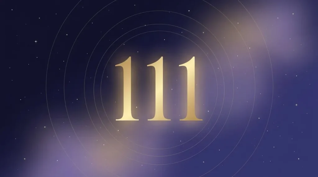 Angel number 111 in gold numerals on a starry midnight sky